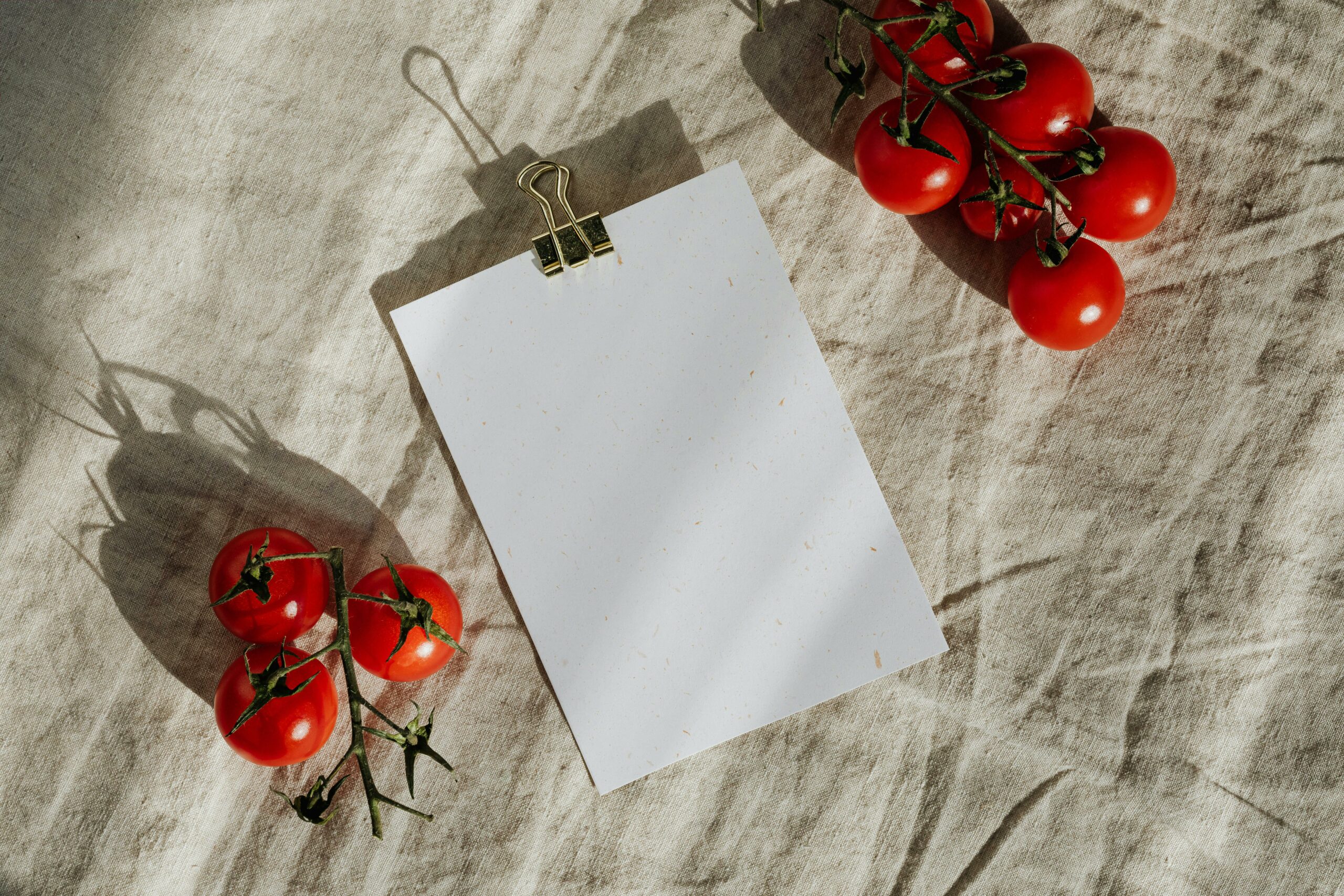 Tomatoes and piece of paper